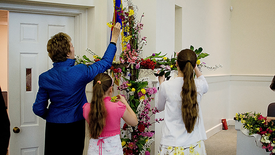 Adding flowers to the Cross